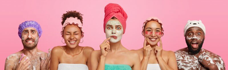 people making faces while having skin face products on their faces